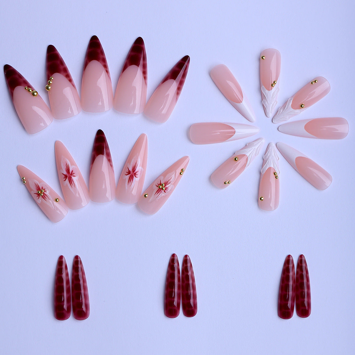 Kunstfingernägel Im Eleganten Modernen Stiletto-Stil mit Floralem Design und Goldenen Akzenten Brehn