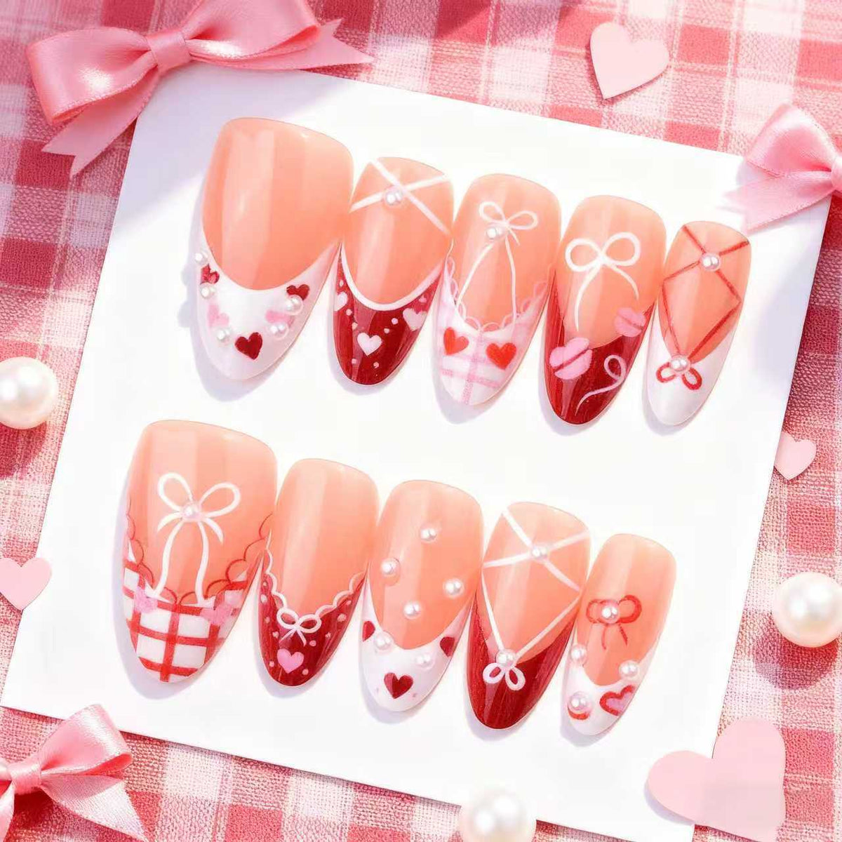 Dekoratives Presse-On Nagelkunstset mit Schleifen- und Herzen-Designs Brehn