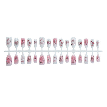 Elegantes Kunstnagelset mit floralen und Glitzerdetails Brehn