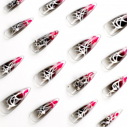 Kunstvolle Stiletto-Nägel mit eleganter Dekoration und modernen Akzenten Brehn