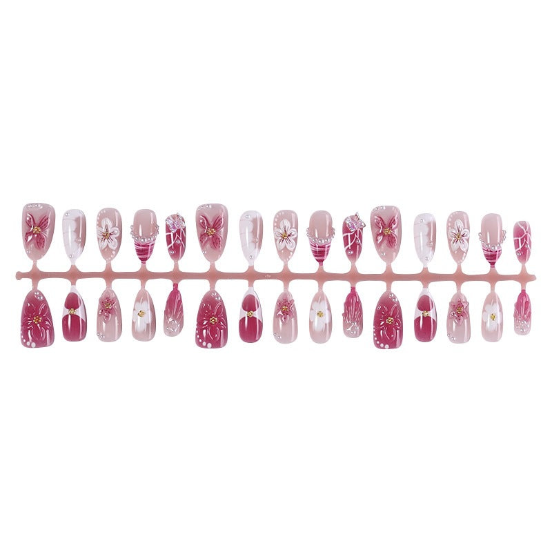 Kreatives Kunstnagelset mit floralen Akzenten und Glitzerverzierungen Brehn