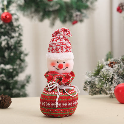 Niedlicher Weihnachtsgnom mit Geschenkesack Brehn