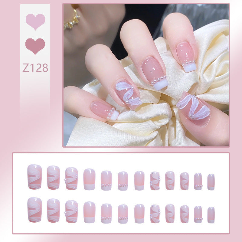 Kunstnagelset mit eleganten Wellenmustern und zarten Perlenakzenten Brehn