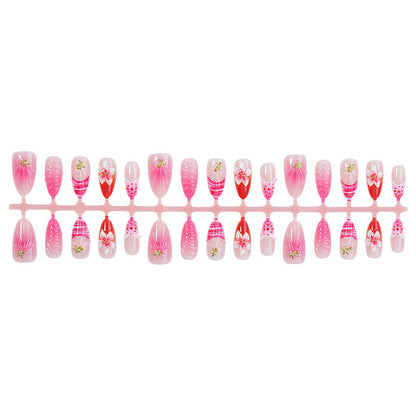 Kunstnagelset mit blühenden 3D-Details und Glitzerakzenten Brehn