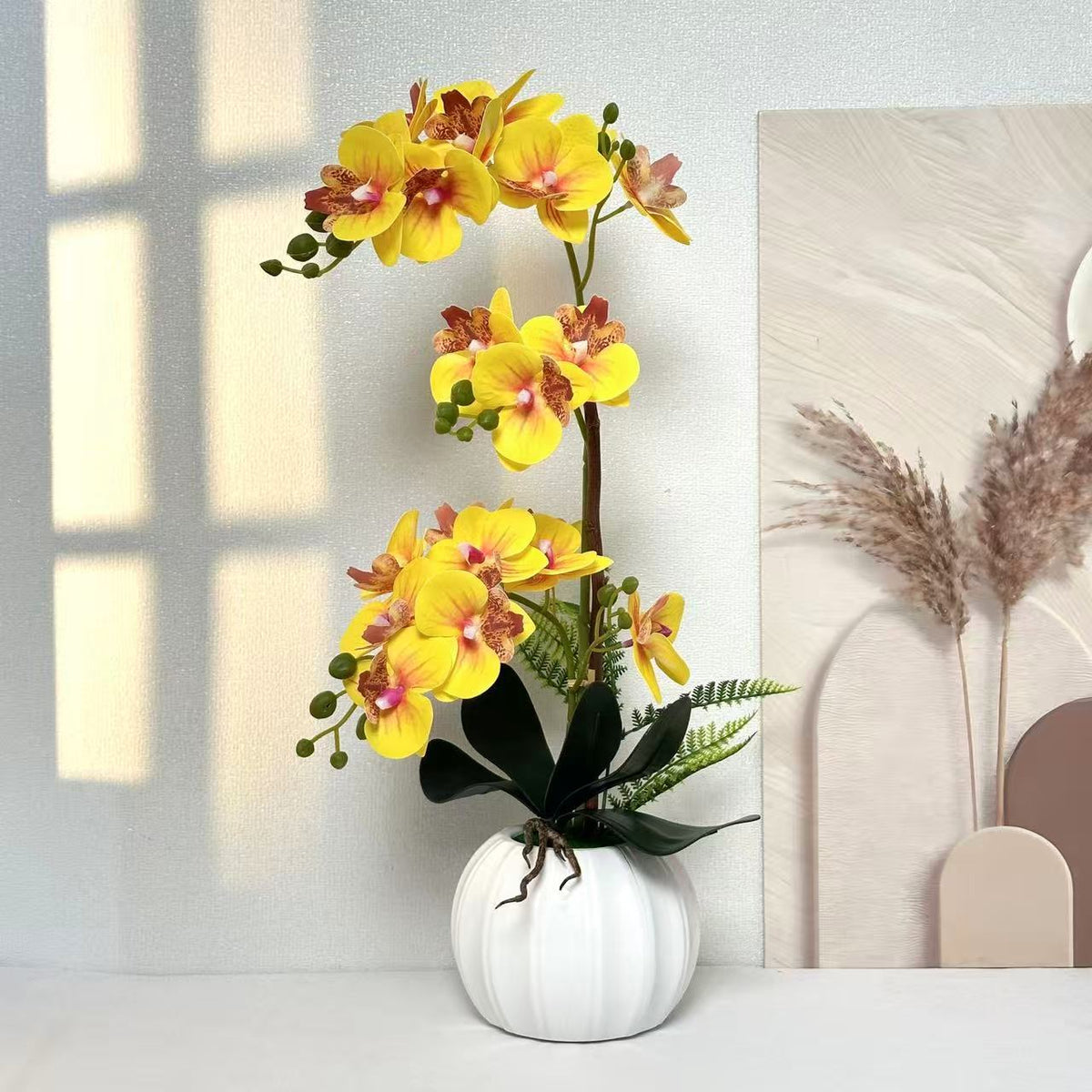Elegante künstliche Orchideenarrangement für die Innenraumdekoration