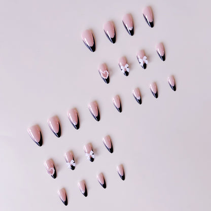 Glamouröse Kunstnagelspitzen mit 3D Schleifen und Herzverzierungen Brehn