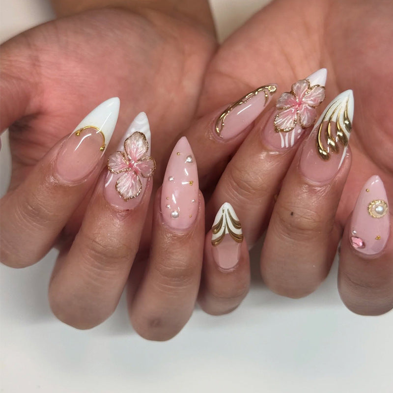 Künstlerisches Stiletto Press-On Nagelset mit floralem und goldenen Akzenten Brehn