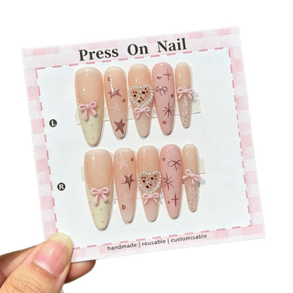 Dekoratives Press-On Nagelkunstset mit Schleifen- und Herzdrucken