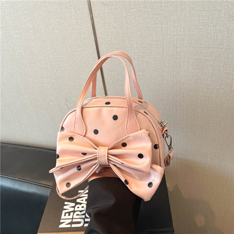 Schleifenverzierte Handtasche