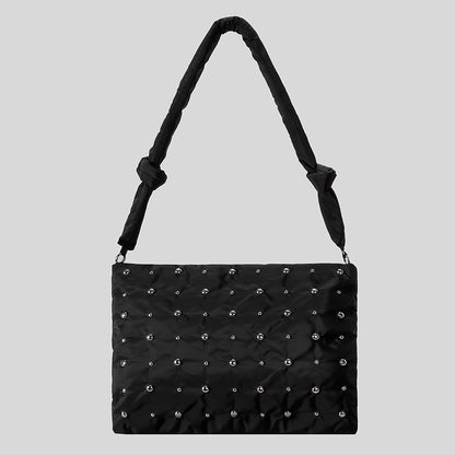 Dekorativer gesteppter Handtasche