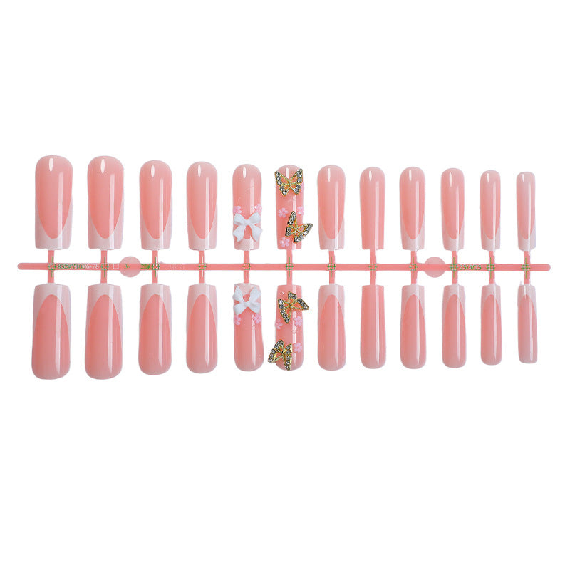 Dekoratives Press-On-Nagelset mit floralen und Schmetterlingsakzenten Brehn