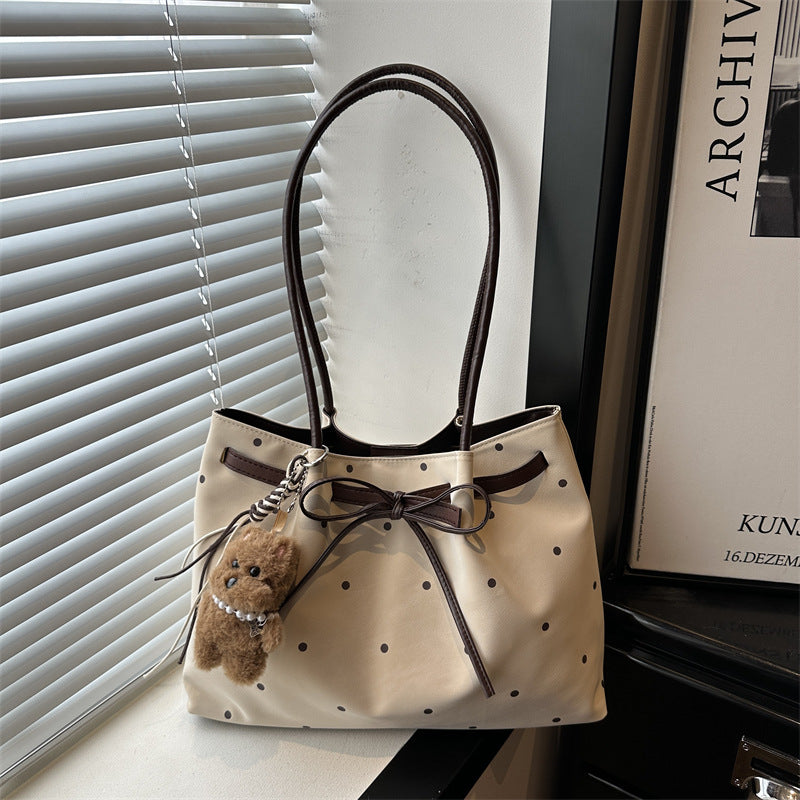 Elegante gepunktete Tragetasche