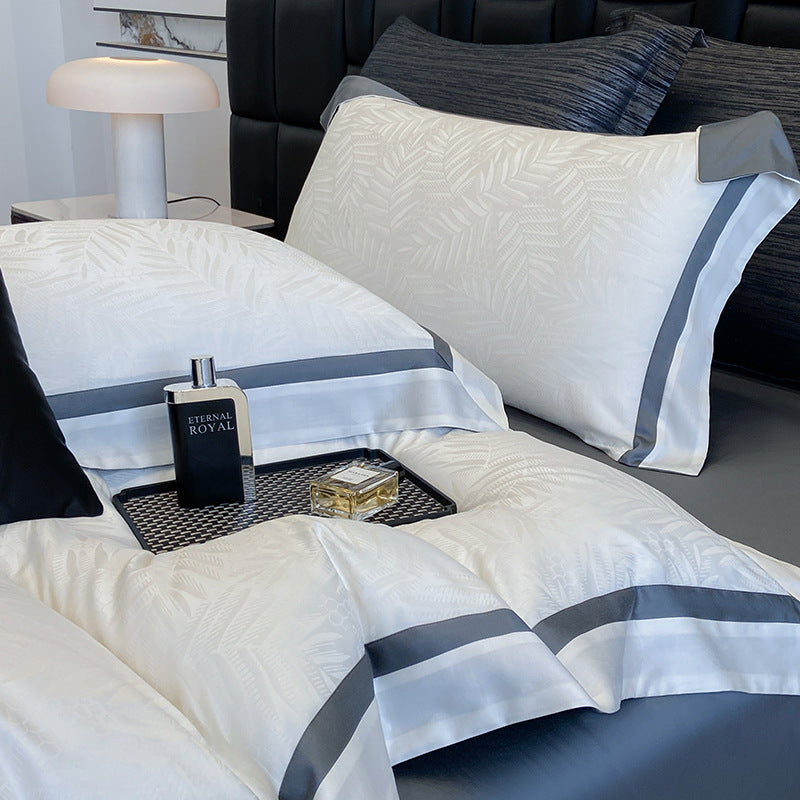 Premium-Bettwäscheset aus Baumwollsatin mit dezentem Blattmuster und feiner Kederkante