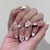 Kunstnagelset mit eleganten Verzierungselementen Brehn