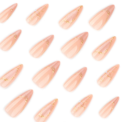 Kunstvolle Stiletto-Nägel mit Goldakzenten Brehn
