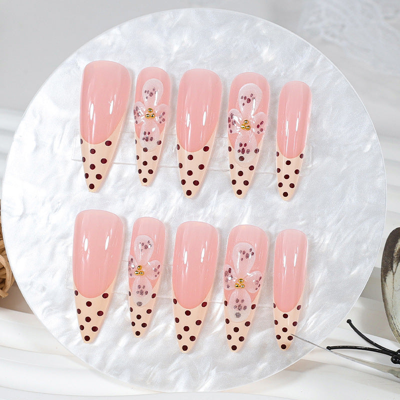 Kunstnagelset mit eleganten Blüten- und Punktemotiven Brehn