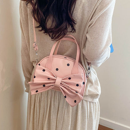Schleifenverzierte Handtasche