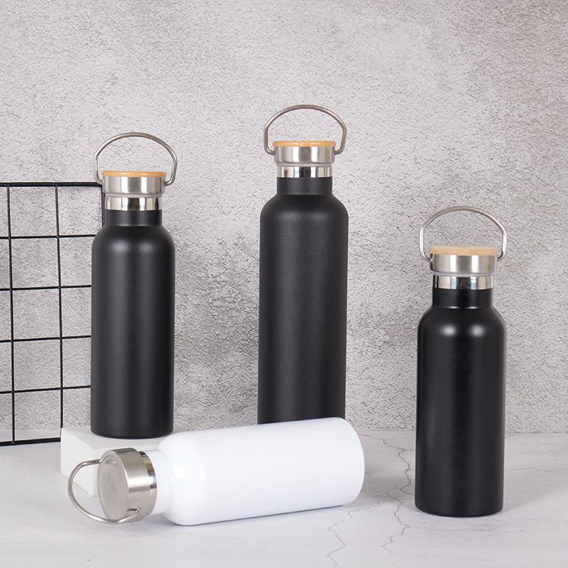 Damen Edelstahl Trinkflasche mit Bambusdeckel und Tragegriff Brehn