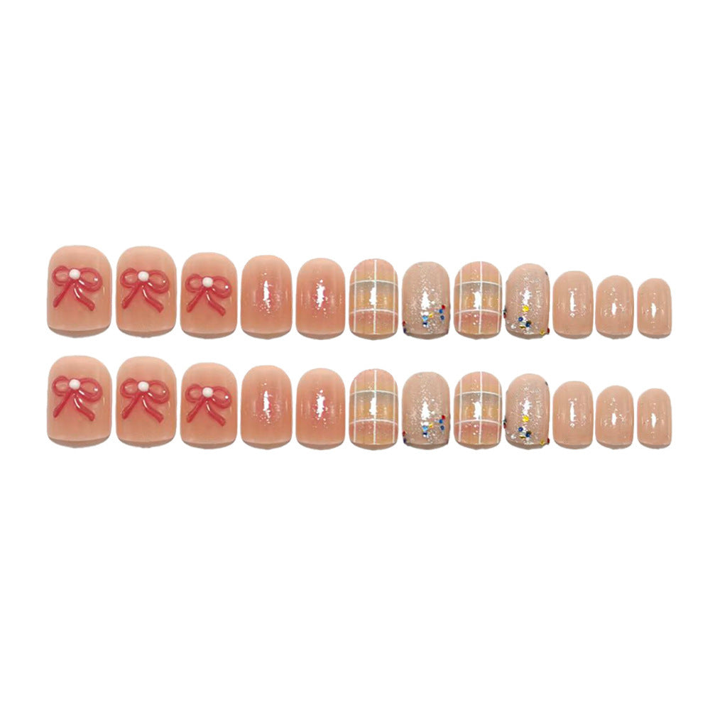 Kreatives Kunstnagelset mit Glitzer und Blumenapplikationen Brehn