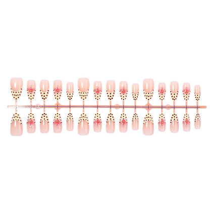 Kunstnagelset mit floralem Design und eleganten Punkten Brehn