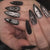 Dekorativer Presse-on-Nagelset mit künstlerischem Spinnendesign Brehn
