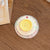 Dekorativer Untersetzer im Button-Design Brehn
