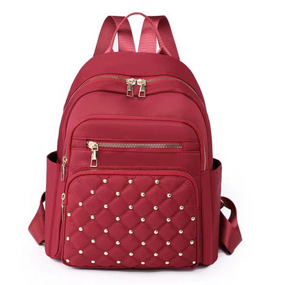 Quilted Rucksack mit dekorativen Nieten Brehn