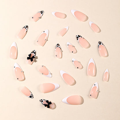 Elegante Stiletto Nagelkunstverlängerungen mit dekorativen Schleifen Brehn