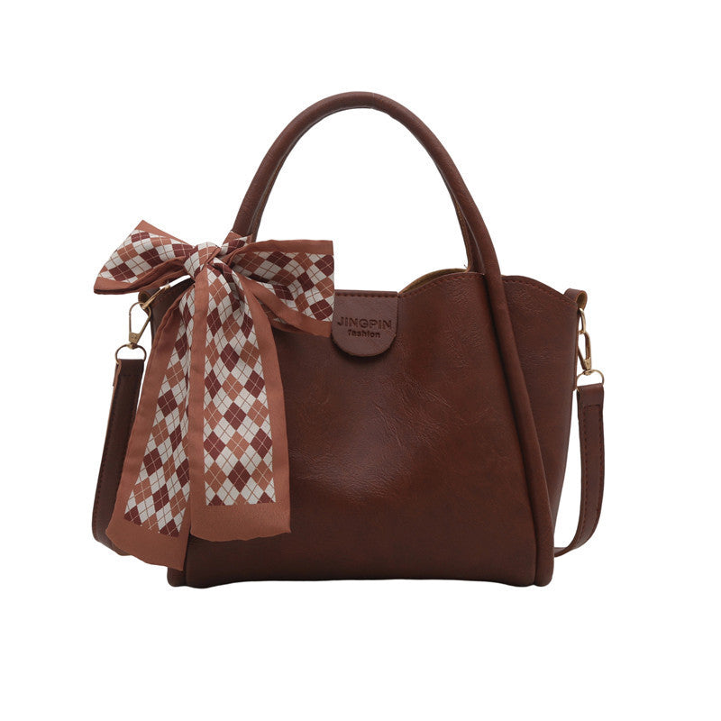 Elegante Schleifenakzent-Handtasche Brehn