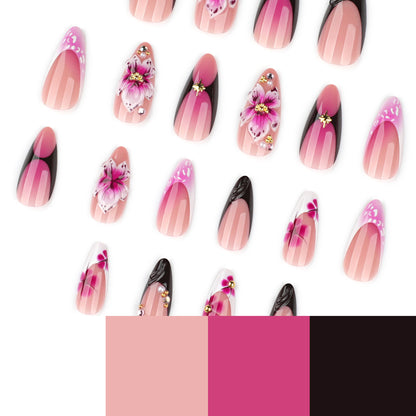 Kunstvolle Stiletto-Nägel mit blühendem Design und Glitzerakzenten Brehn