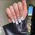 Kunstnagelset mit glamourösen Strass- und eleganten Spitzenverzierungen Brehn