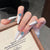 Elegante mit Edelsteinen verzierte Press-On Nagelerweiterungen Brehn