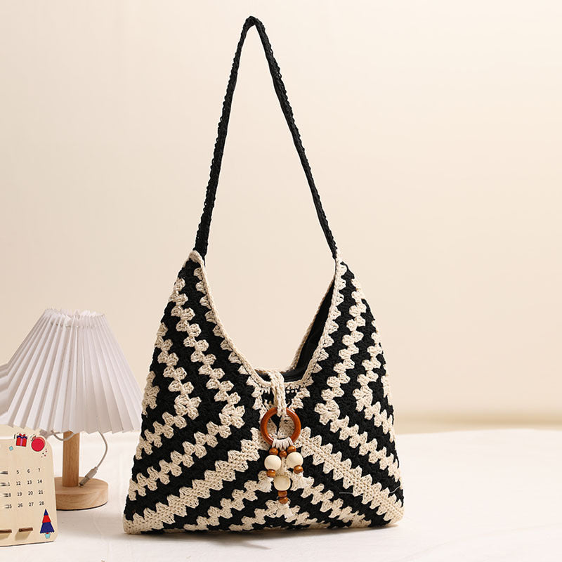 Damen Handtasche mit kunstvollem Flechtmuster Brehn