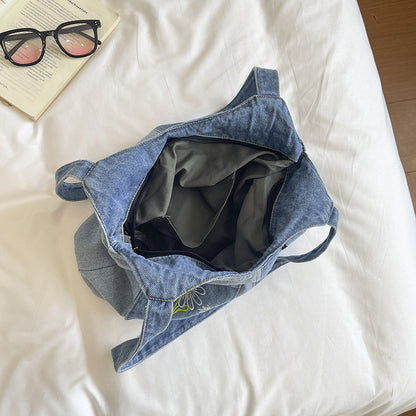 Künstlerisch bestickte Denim-Handtasche
