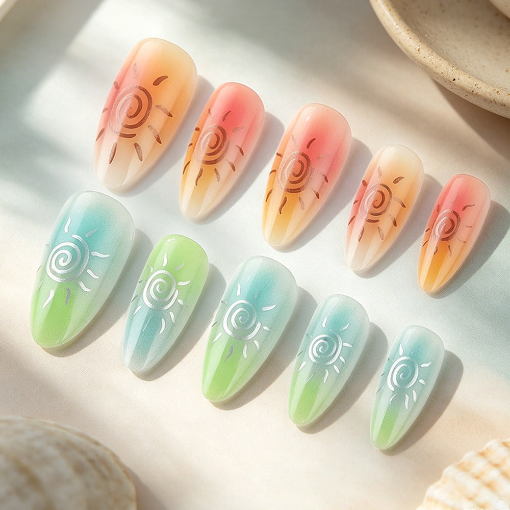 Künstlerisches Press-On-Nagelset mit Sonnendesigns Brehn