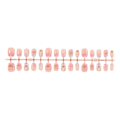 Kunstnagelset mit floralen Designs und eleganten Glitzerelementen Brehn