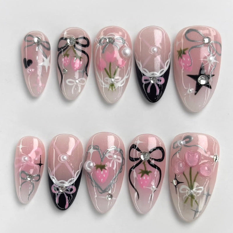 Kreatives Kunstnagelset mit eleganten Schleifen- und Glitzermotiven Brehn