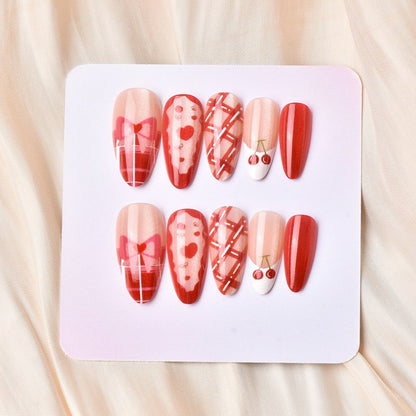 Kunstnagelset mit verspielten Herz- und Kirschmotiven Brehn