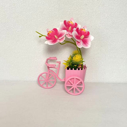 Dekorativer Fahrrad-Blumentopf mit Kunstorchideen-Arrangements für Dekor