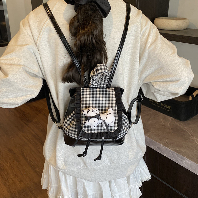 Verspielter Rucksack mit Karomuster und Tierapplikation Brehn