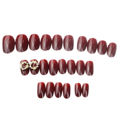 Glänzendes rotes Press-On-Nagelset mit eleganten Perlenakzenten Brehn