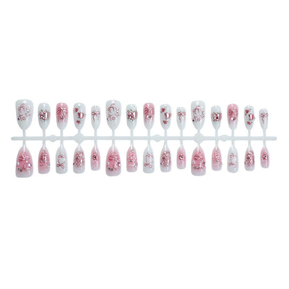 Elegantes Kunstnagelset mit floralen und Glitzerdetails Brehn