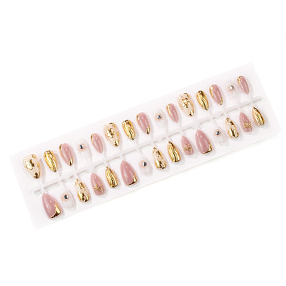 Dekoratives Press-On Nagelkunst-Set mit goldenen Akzenten Brehn