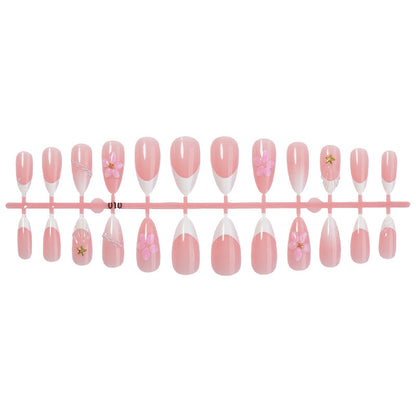 Kunstnagelset mit eleganten Blüten- und Glitzerakzenten Brehn