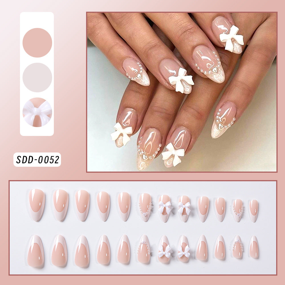Dekorative Press-On-Nageltips mit Schleifenakzenten Brehn