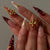 Verschnörkelte Nagelkunst Brehn