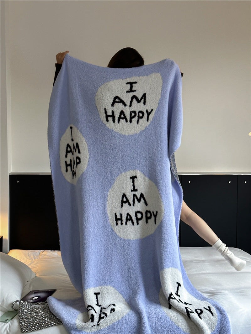 Kuscheldecke mit großem Schriftmotiv und weichem Bouclégewebe