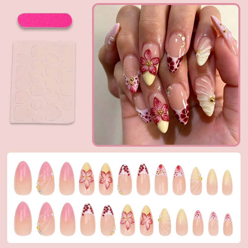 Kunstnagelset mit kreativen floralem Design und glitzernden Akzenten Brehn