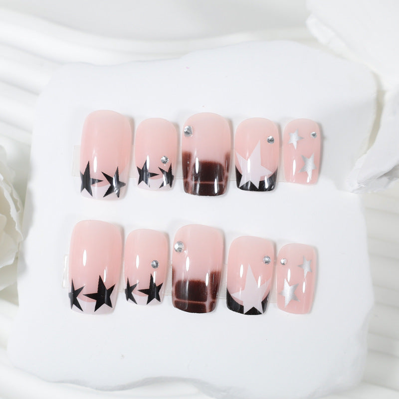 Kunstnagelset mit glamourösen Sternen- und Glitzerakzenten Brehn