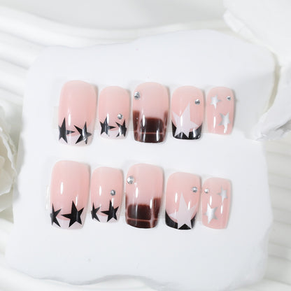 Kunstnagelset mit glamourösen Sternen- und Glitzerakzenten Brehn